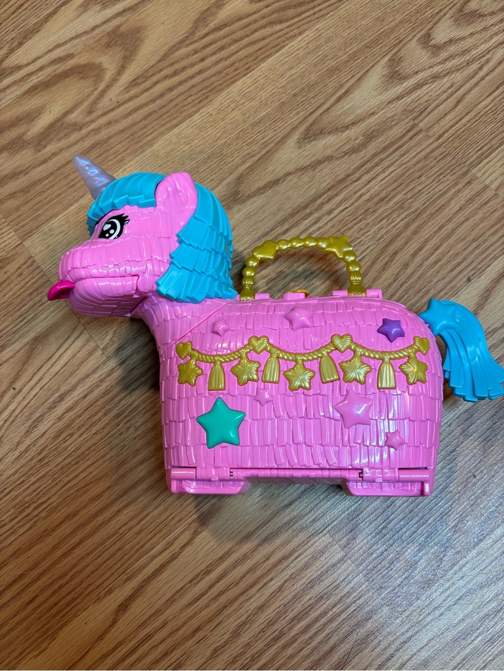 Polly Pocket Unicorn Partyland Playset with gold handle